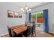 Bright dining area with backyard access and a contemporary table, perfect for enjoying meals with a view at 1021 Sweet Cream Ct, Durham, NC 27703