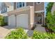 Close-up of home exterior with brick-accented garage and inviting front entryway at 1021 Sweet Cream Ct, Durham, NC 27703
