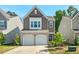 Charming two-story home featuring a two-car garage and beautifully landscaped front yard at 1021 Sweet Cream Ct, Durham, NC 27703