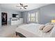 Bright main bedroom with ample closet space, dresser, and a calming color palette for ultimate comfort at 1021 Sweet Cream Ct, Durham, NC 27703
