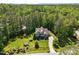 Aerial of stunning home surrounded by lush greenery showcasing its prime location and curb appeal at 1037 Lila Ln, Raleigh, NC 27614