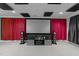 This finished basement media room features a large projector screen and high-end speakers for enhanced experiences at 1037 Lila Ln, Raleigh, NC 27614
