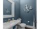 Stylish half bath with nautical decor and vanity at 1037 Lila Ln, Raleigh, NC 27614