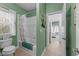 Fresh bathroom with a shower and tub, plus an adjacent doorway with open bedroom beyond at 1037 Lila Ln, Raleigh, NC 27614