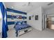 Carolina-themed bedroom with blue and white accents, and bright natural light at 1037 Lila Ln, Raleigh, NC 27614