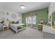 Bright bedroom featuring a stylish accent wall, white furniture, and leafy green botanical accents at 1037 Lila Ln, Raleigh, NC 27614