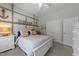 Coastal-themed bedroom featuring a white bed, seaside decor, and an anchor wall decoration at 1037 Lila Ln, Raleigh, NC 27614