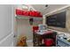 Quaint craft room with red baskets, charming decor, sewing machine, and a cozy dog at 1037 Lila Ln, Raleigh, NC 27614
