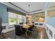 Charming dining area with designer touches, seating for six, and ample natural light at 1037 Lila Ln, Raleigh, NC 27614