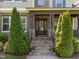 Stone steps lead to a covered porch at the front entrance of the home at 1037 Lila Ln, Raleigh, NC 27614