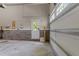 Clean and organized garage with door to exterior at 1037 Lila Ln, Raleigh, NC 27614