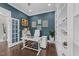 Another shot of a home office with built in shelves, desk and modern decor at 1037 Lila Ln, Raleigh, NC 27614