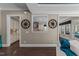 Open concept living room with hardwood floors, showcases a view into a modern kitchen with ample natural light at 1037 Lila Ln, Raleigh, NC 27614