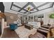 Inviting living room featuring hardwood floors, a coffered ceiling, and ample seating, perfect for entertaining guests at 1037 Lila Ln, Raleigh, NC 27614