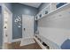 Mud room featuring built-in storage, bench seating, and coat hooks at 1037 Lila Ln, Raleigh, NC 27614