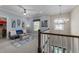 Comfortable upstairs sitting area with modern chandelier, plush seating, and natural light at 1037 Lila Ln, Raleigh, NC 27614