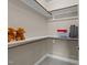 Organized walk-in closet with shelving and storage for all your belongings, plus charming stuffed animals at 1037 Lila Ln, Raleigh, NC 27614