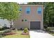 Exterior of modern two-story home featuring attached garage and manicured landscaping at 1041 Cotulla Dr, Morrisville, NC 27560