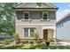 Charming home featuring neutral siding, complementary shutters, and a well-manicured front lawn at 1041 Cotulla Dr, Morrisville, NC 27560