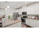 Modern kitchen featuring granite countertops, stainless steel appliances, and lots of cabinet space at 1041 Cotulla Dr, Morrisville, NC 27560