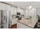 Bright kitchen featuring stainless steel appliances, granite countertops, and white cabinetry at 1041 Cotulla Dr, Morrisville, NC 27560