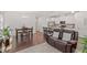 Open-concept living room and kitchen featuring modern finishes and hardwood flooring throughout the space at 1041 Cotulla Dr, Morrisville, NC 27560