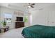 Spacious main bedroom with windows, tray ceiling, fan and sitting area at 1041 Cotulla Dr, Morrisville, NC 27560