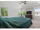 Spacious main bedroom with windows, tray ceiling, fan and sitting area at 1041 Cotulla Dr, Morrisville, NC 27560