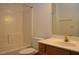 Bright bathroom featuring a single sink, vanity, toilet, and shower-tub combo at 10461 Dapping Dr, Raleigh, NC 27614