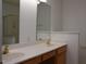 Bathroom featuring double vanity with wood cabinets at 10461 Dapping Dr, Raleigh, NC 27614