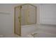 Bathroom featuring separate glass enclosed shower and a soaking tub at 10461 Dapping Dr, Raleigh, NC 27614