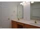 Bathroom featuring double vanity and a large mirror at 10461 Dapping Dr, Raleigh, NC 27614