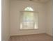 Bright bedroom with a large window and neutral carpet at 10461 Dapping Dr, Raleigh, NC 27614