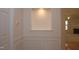 Entryway with wainscoting detail with view into the living room at 10461 Dapping Dr, Raleigh, NC 27614