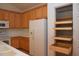 Kitchen features a pantry with pull out drawers for optimized storage at 10461 Dapping Dr, Raleigh, NC 27614