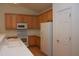 Functional kitchen featuring ample cabinet space and white appliances at 10461 Dapping Dr, Raleigh, NC 27614