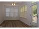 Bright sunroom with hardwood floors, windows and an exterior door at 10461 Dapping Dr, Raleigh, NC 27614