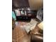 Spacious basement bar with seating, tile floor, and ample storage for entertaining guests at 10505 Winding Wood Trail Trl, Raleigh, NC 27613