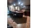 Finished basement bar with custom cabinetry and ample seating at 10505 Winding Wood Trail Trl, Raleigh, NC 27613
