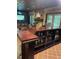 Basement custom bar area with display shelving and neon lighting at 10505 Winding Wood Trail Trl, Raleigh, NC 27613