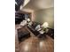 Basement living room with leather sofa, ottoman, and lamps for cozy evenings at 10505 Winding Wood Trail Trl, Raleigh, NC 27613