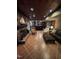 Finished basement with brick fireplace, copper ceiling tiles and bar area at 10505 Winding Wood Trail Trl, Raleigh, NC 27613