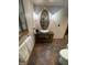 Bathroom sink and fixtures include an oval mirror with sconces at 10505 Winding Wood Trail Trl, Raleigh, NC 27613