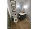Light and airy bathroom with a toilet, a modern vanity with framed mirror, and neutral wall color at 10505 Winding Wood Trail Trl, Raleigh, NC 27613