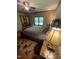 Bedroom with beautiful rug, stylish decor, and view of a window at 10505 Winding Wood Trail Trl, Raleigh, NC 27613