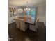 Formal dining room with hardwood floors, chandelier lighting and a large wood table at 10505 Winding Wood Trail Trl, Raleigh, NC 27613