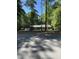 Exterior view of a home nestled among mature trees at 10505 Winding Wood Trail Trl, Raleigh, NC 27613