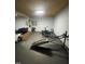 Home gym featuring exercise equipment, mirrors, and rubber flooring for a dedicated fitness space at 10505 Winding Wood Trail Trl, Raleigh, NC 27613