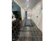 Inviting hallway features tile flooring, neutral paint, and bright white doors at 10505 Winding Wood Trail Trl, Raleigh, NC 27613