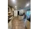 Well-equipped kitchen featuring granite counters, stainless steel appliances, and custom cabinetry at 10505 Winding Wood Trail Trl, Raleigh, NC 27613